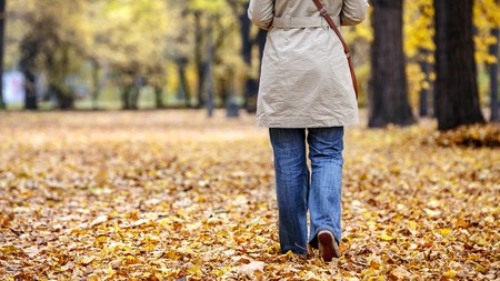 57920236 - lonely woman in a park in autumn